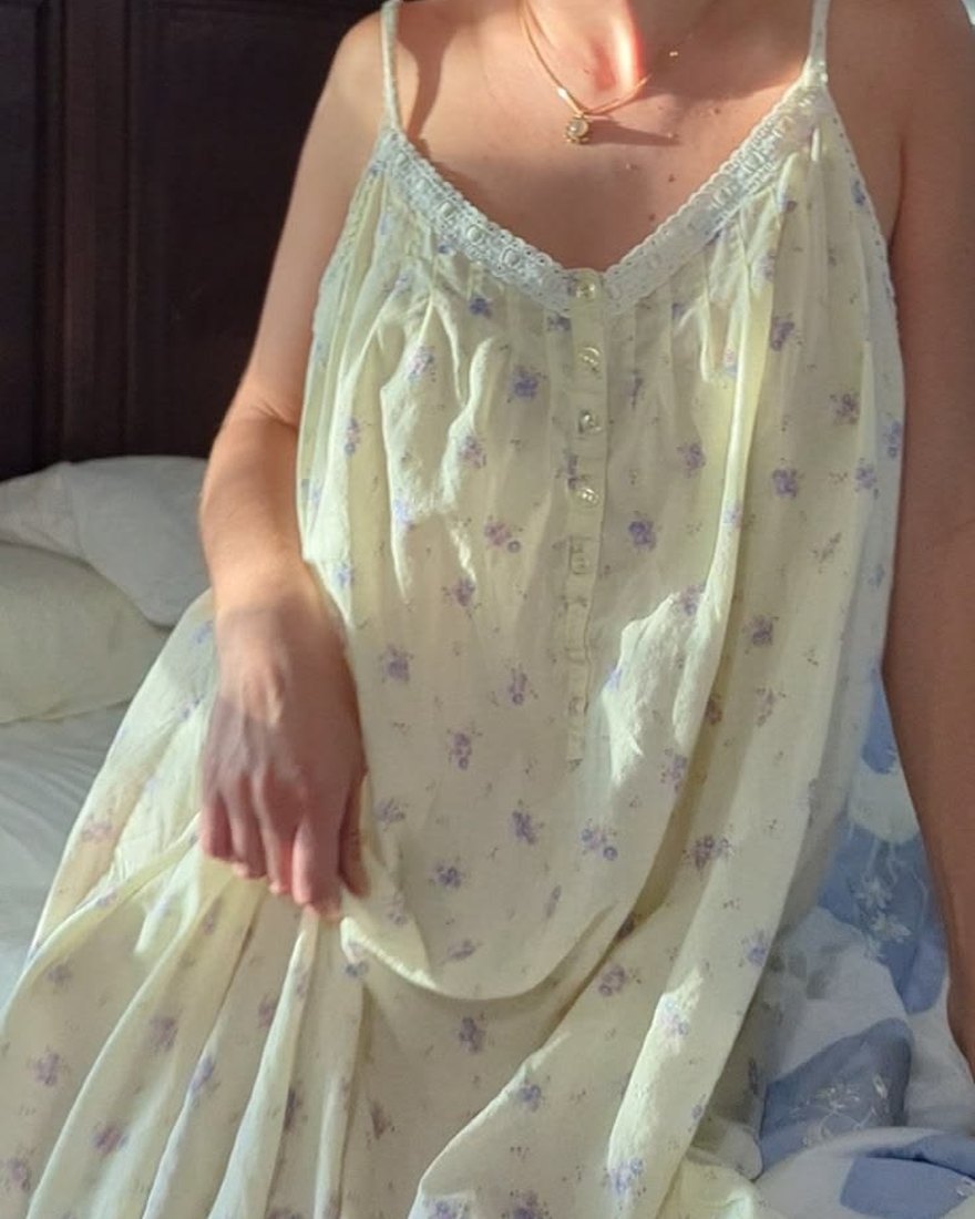 Yellow floral print nightgown with a lace-trimmed neckline and button placket