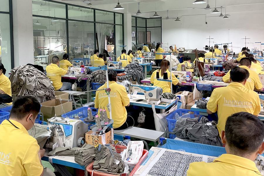 Sewing operators working on garments in KoalaPurr’s manufacturing setup