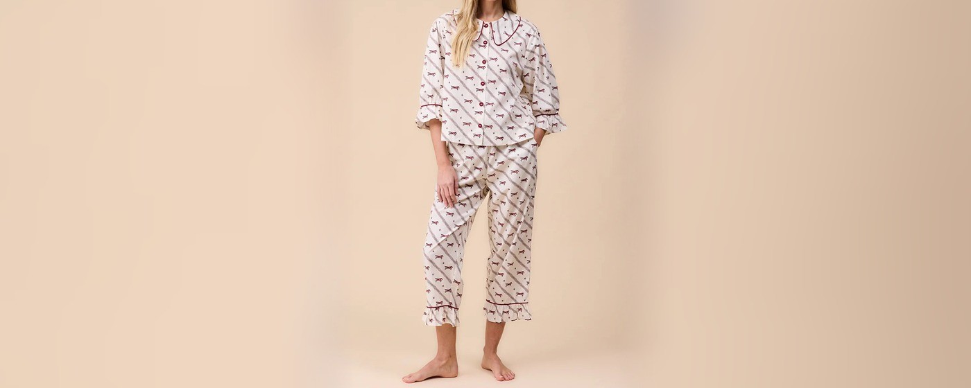 Women's cream cotton pajama set with a burgundy galloping horse print and piped collar