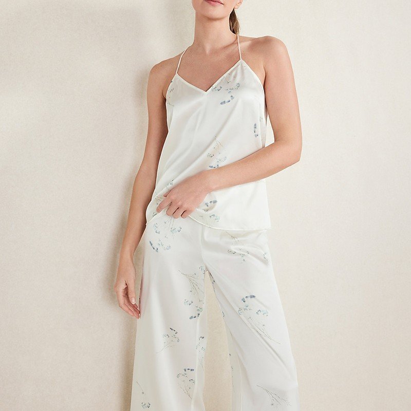 Back view of the cross-back spaghetti straps on the floral satin cami