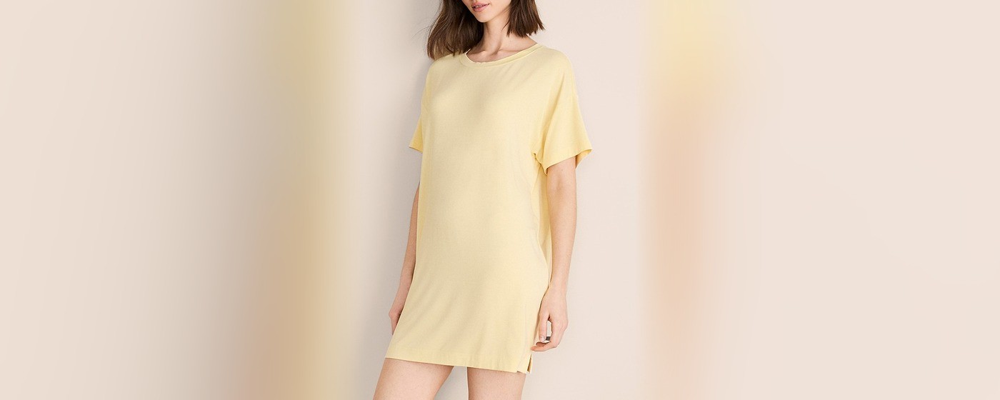 Butter yellow modal jersey sleep tee dress with a crew neck and side slits