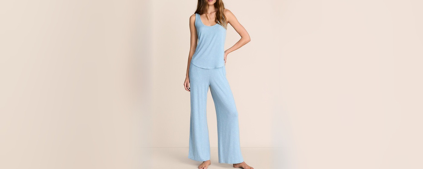 Sky blue modal pajama pants with an all-over white star print and wide leg