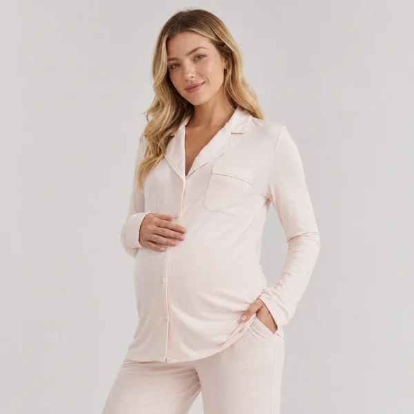 Blush pink modal maternity pajama set with a button front placket on a pregnant model