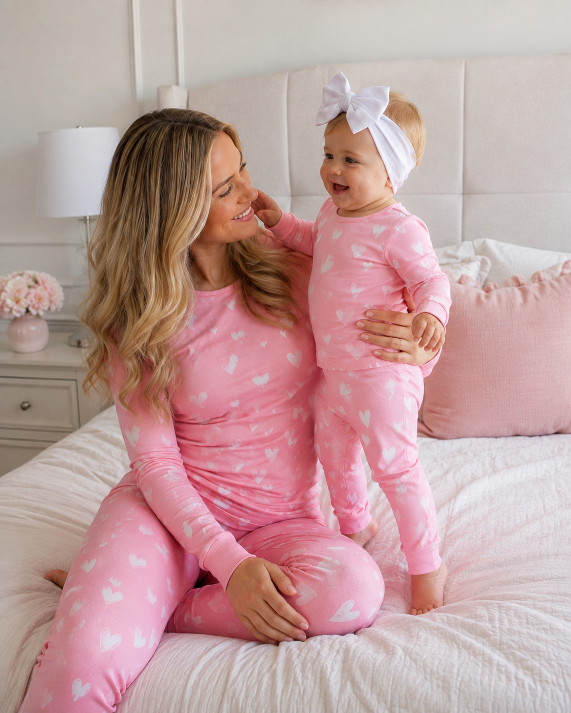 Bamboo family sleepwear detail featuring matching pink heart print pajamas for mother and baby