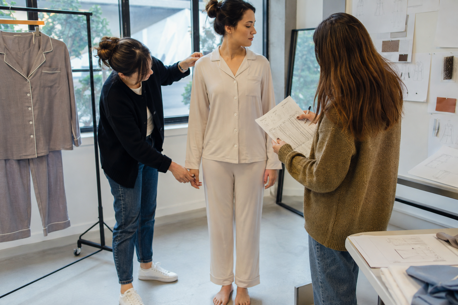 Initial pajama sample fit review with fit model and product developer