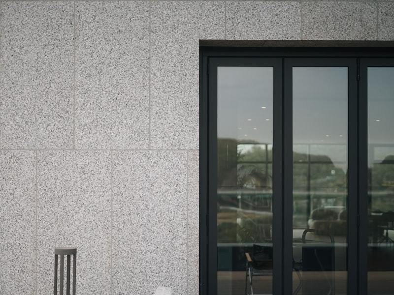 Interior view of a bright modern entry space with aluminum door