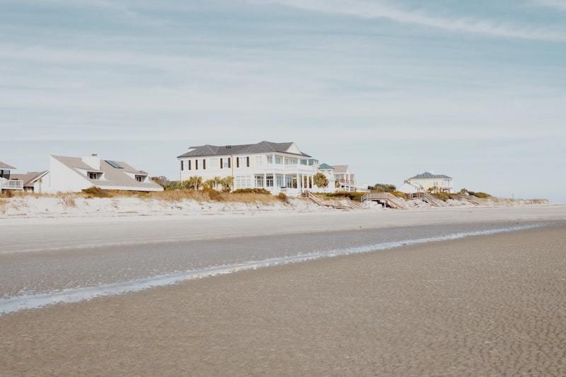 White and gray coastal house showing exterior finish durability