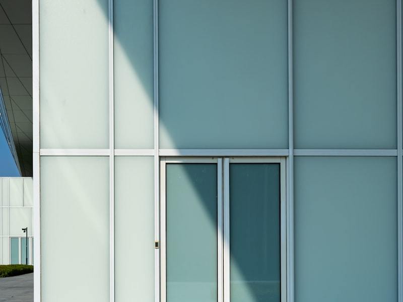 Finished aluminum entry door with aligned hardware in a modern home
