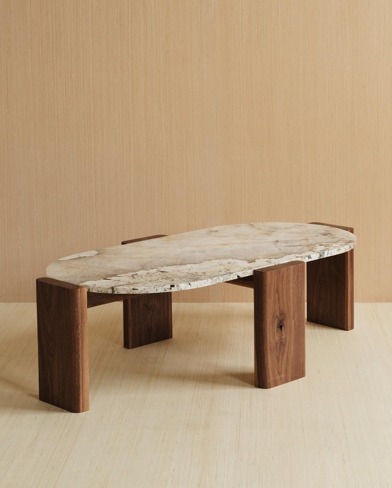 Close-up of the natural marble tabletop and walnut veneer support