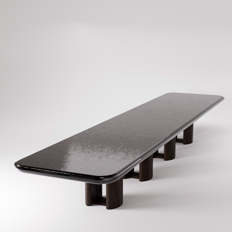 Angled view of a custom marble-top dining table with rounded corners