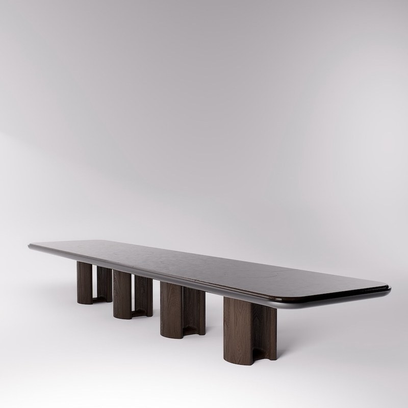 Front view of a long marble dining table with multiple pedestal supports