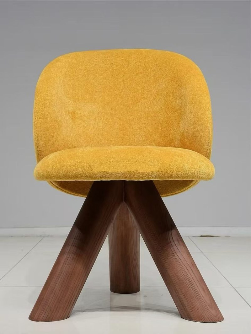A Curved-Back Accent Chair with a Warm, Sculptural Profile