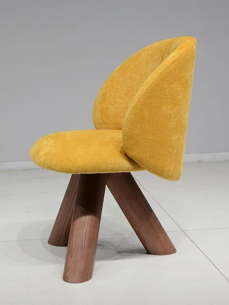 A Curved-Back Accent Chair with a Warm, Sculptural Profile in application