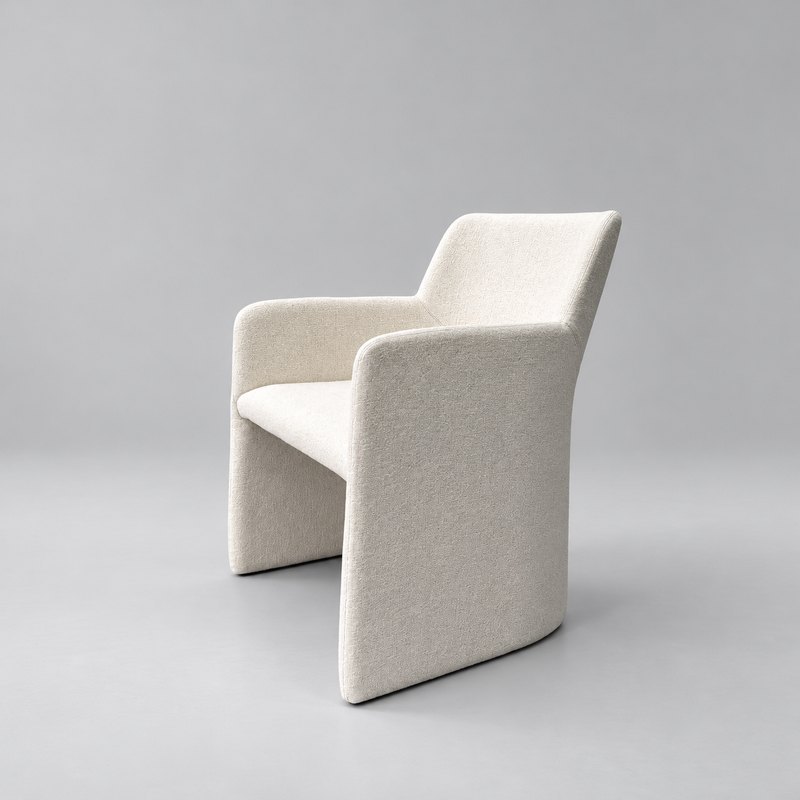 Three-quarter view of sculptural hotel armchair with angled backrest and upholstered panel sides