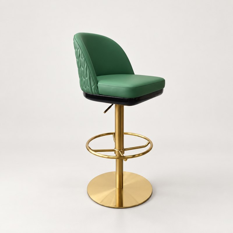 Green leather bar stool with a curved quilted back, gold pedestal and circular footrest
