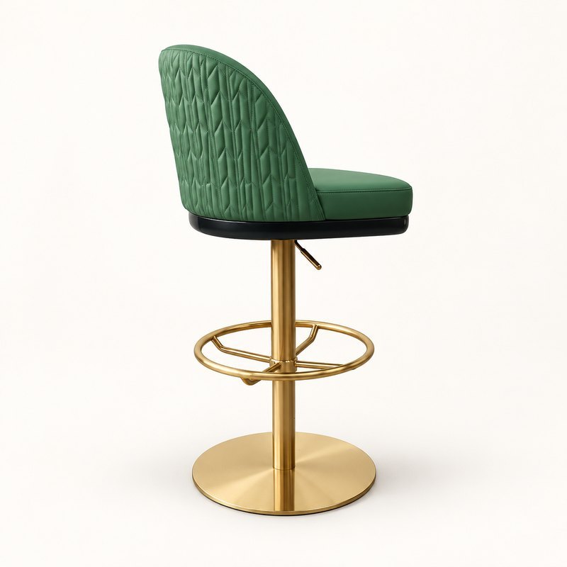 Side view of a leather pedestal bar stool showing its geometric quilted backrest