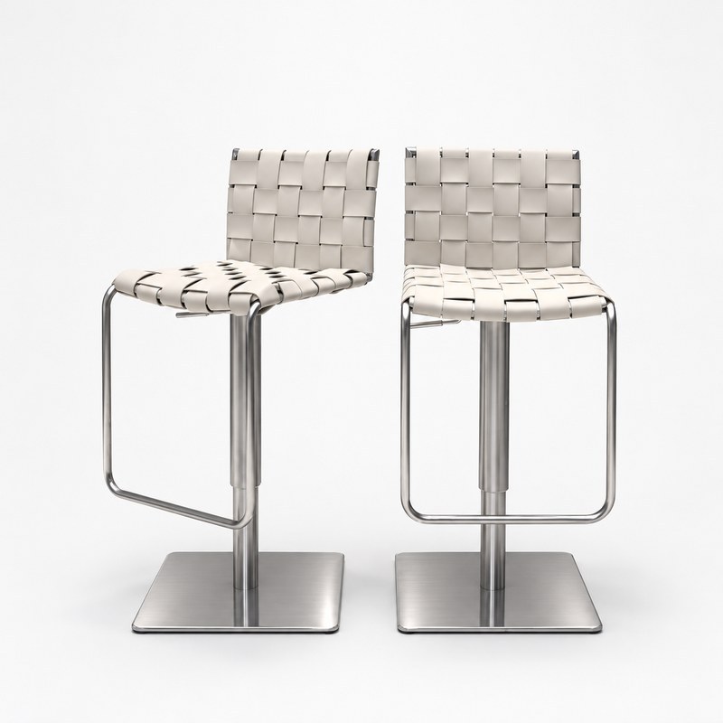 Pair of woven hotel bar stools showing the seat, backrest, metal pedestal, and footrest