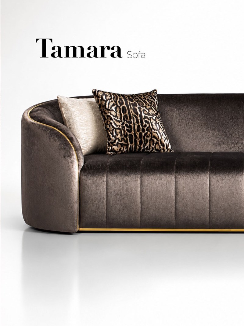 Left-side view of a channel-upholstered hotel suite sofa with rounded arms and decorative pillows