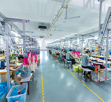 Apparel production workshop with garment workers on sewing lines