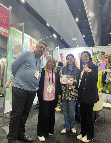 MinCharm representatives meeting visitors at an apparel trade show in Australia in 2023