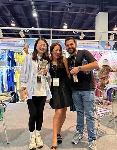 MinCharm team with visitors at MAGIC Las Vegas apparel trade show in 2025