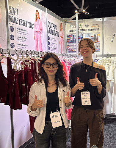 MinCharm representatives at an apparel trade show booth in Australia in 2026