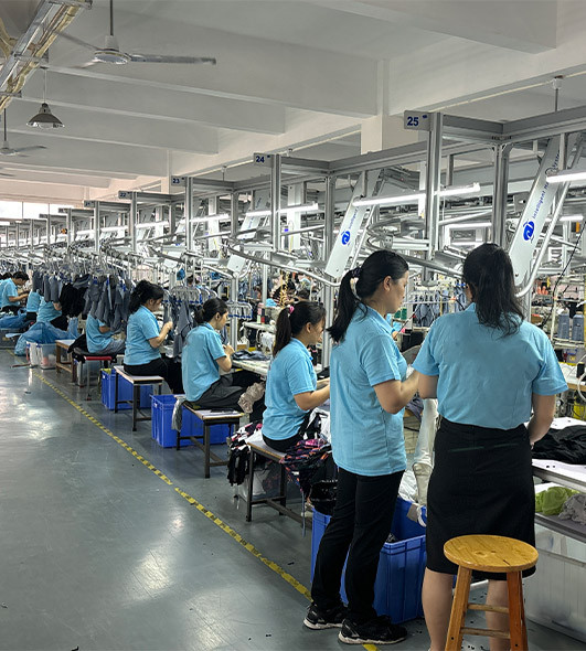 Apparel production lines with garment workers at MinCharm's factory in Dongguan, China