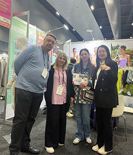 MinCharm representatives meeting visitors at an apparel trade show in Australia in 2023
