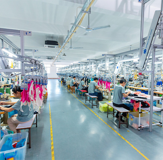 Apparel production lines with garment workers at MinCharm's factory in Dongguan, China