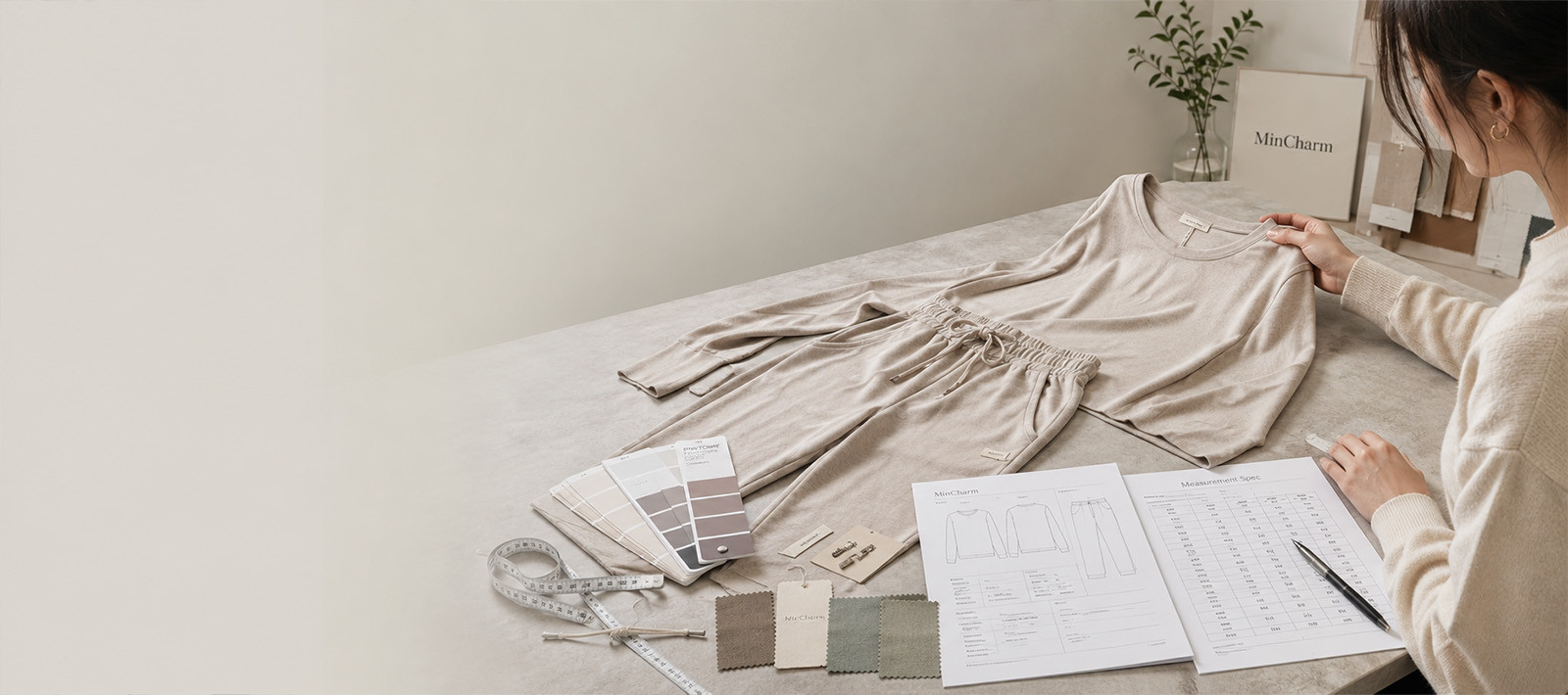 Garment sample, measurement sheet and fabric swatches prepared for sample development