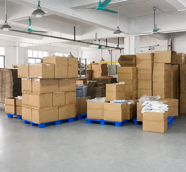 Packed apparel orders and cartons prepared for shipment after production