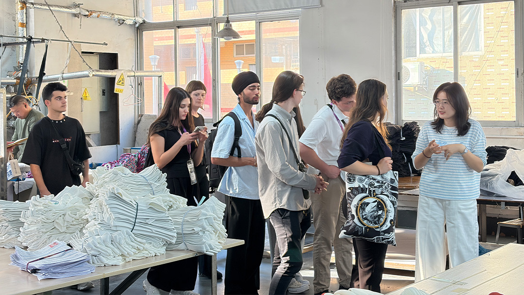 La Trobe Business School students touring the apparel production area at MinCharm