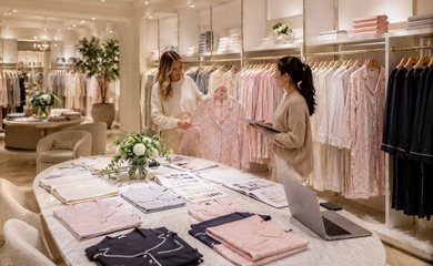 Retail buyer and supplier reviewing pajama styles and color selections