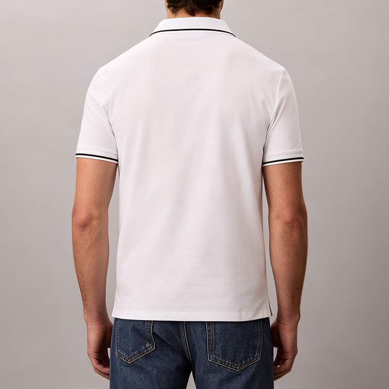 Black trim detail on white polo shirt collar