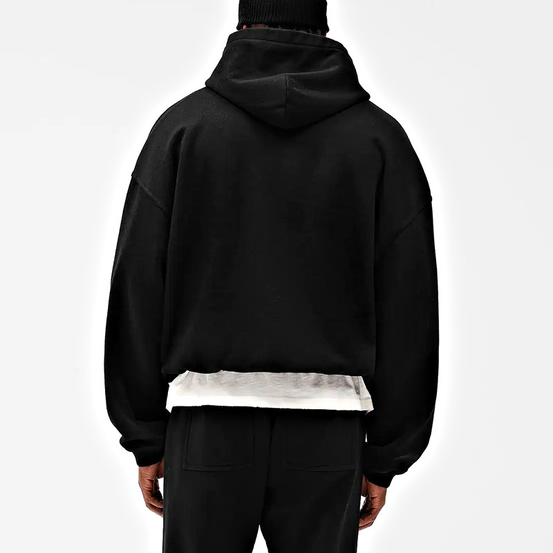 Back view of black oversized hooded sweatshirt