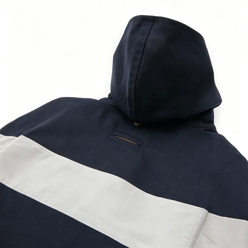 Close view of navy dog raincoat hood with snap fastening
