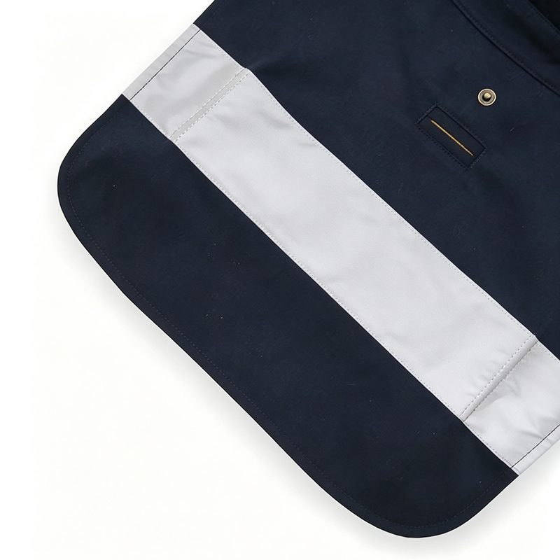 White contrast panel and snap detail on navy canvas dog raincoat