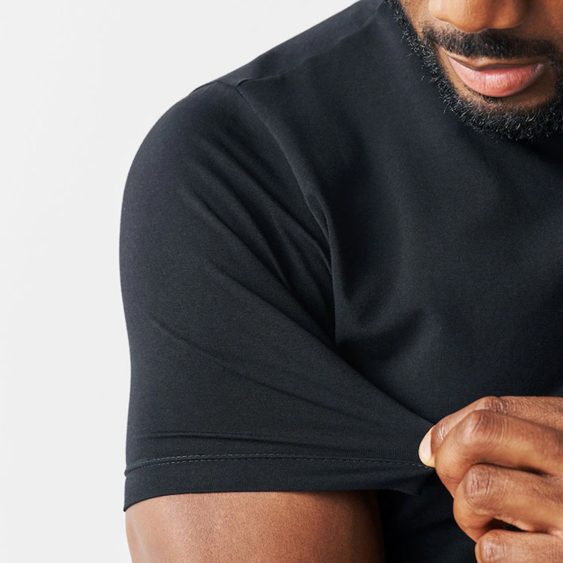 Close-up of black fitted T-shirt sleeve and shoulder