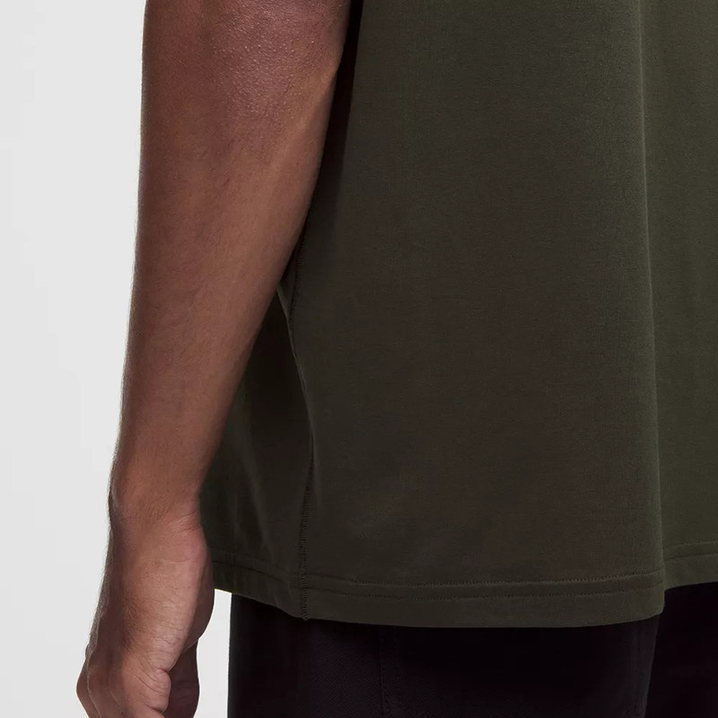 Dark olive T-shirt side seam and hem detail