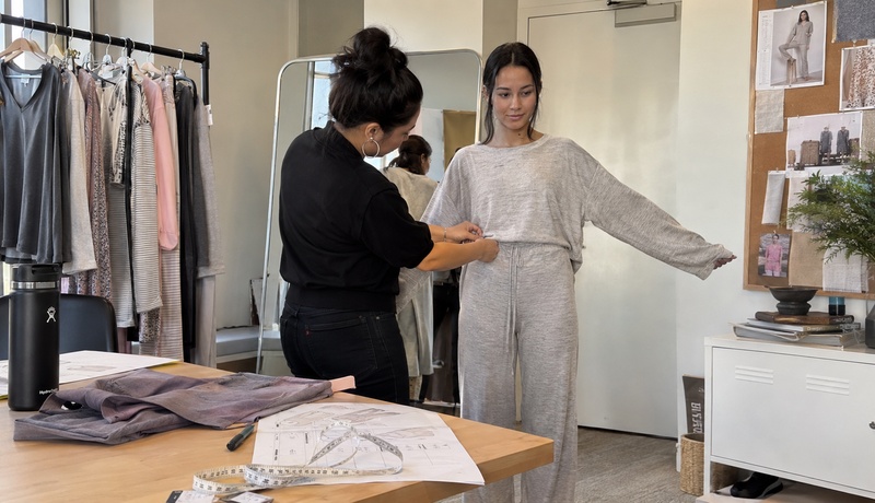 Fit being checked on a women's long-sleeve sleepwear sample