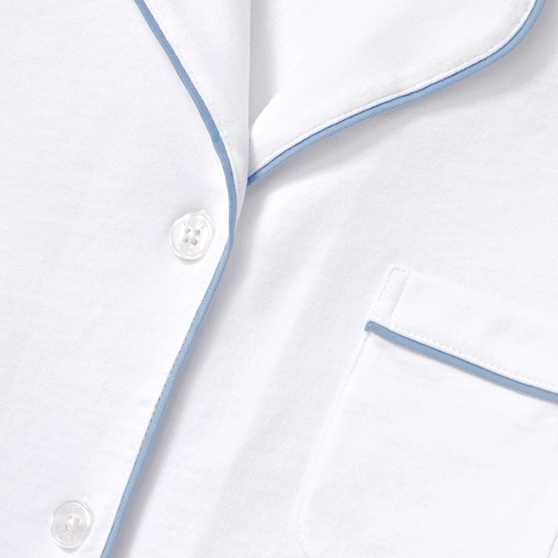 Blue piping and four-button pajama top detail
