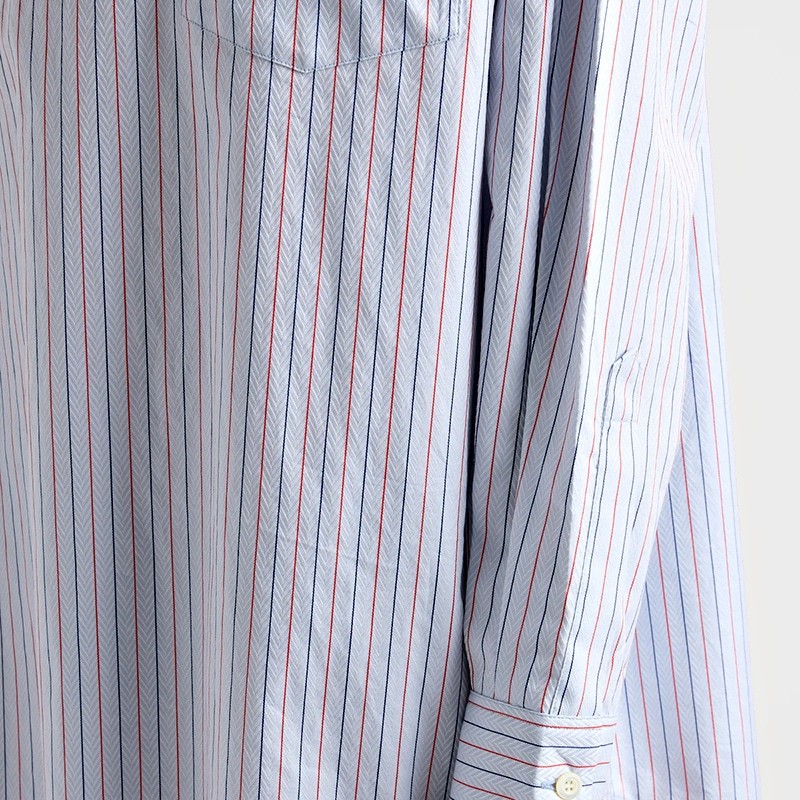 Close detail of the striped fabric and button cuff
