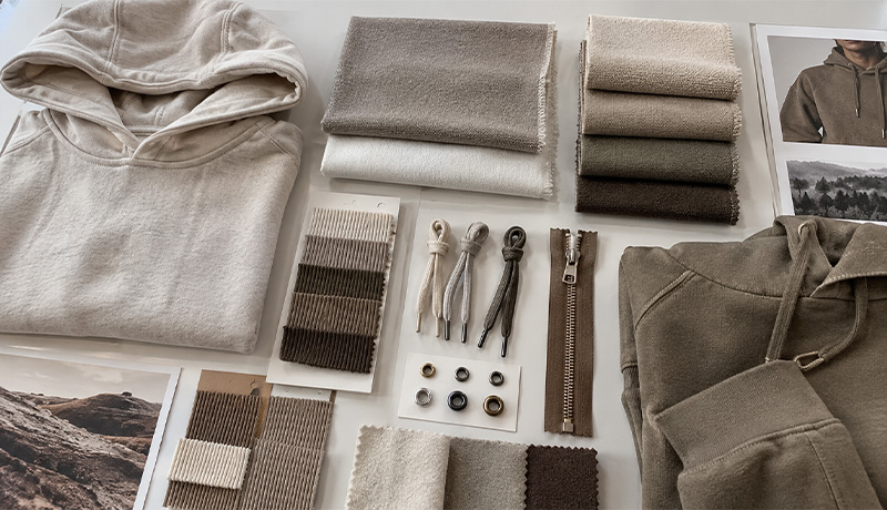Hoodie fabric swatches with rib trims, drawcords, eyelets and zippers
