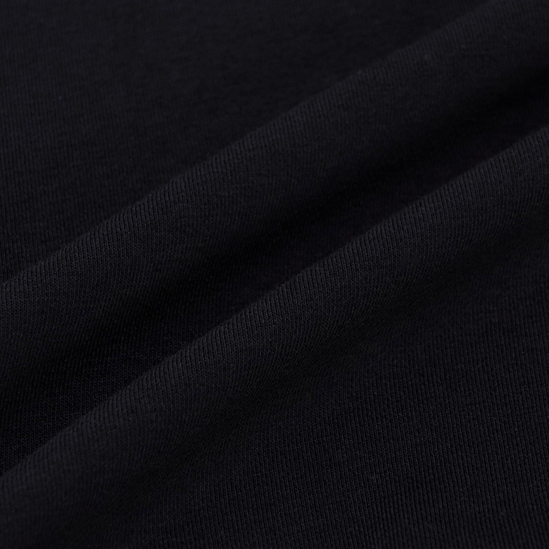 Side view showing cropped hem and contrast rib