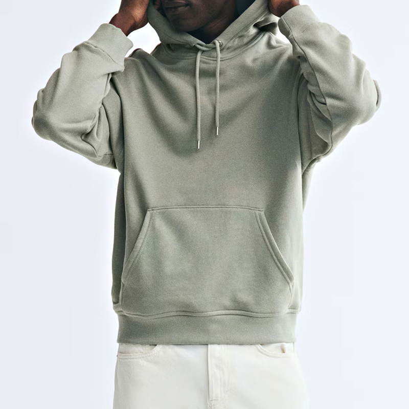 Relaxed drawstring hoodie worn, showing lined hood and kangaroo pocket