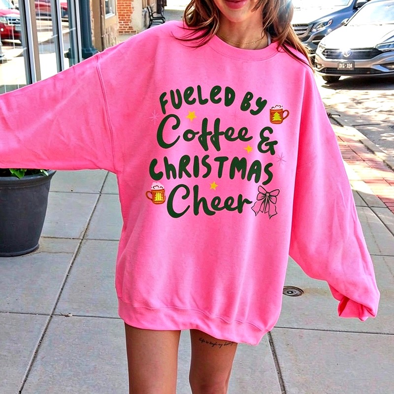 Coffee and Christmas graphic on the women's crewneck front