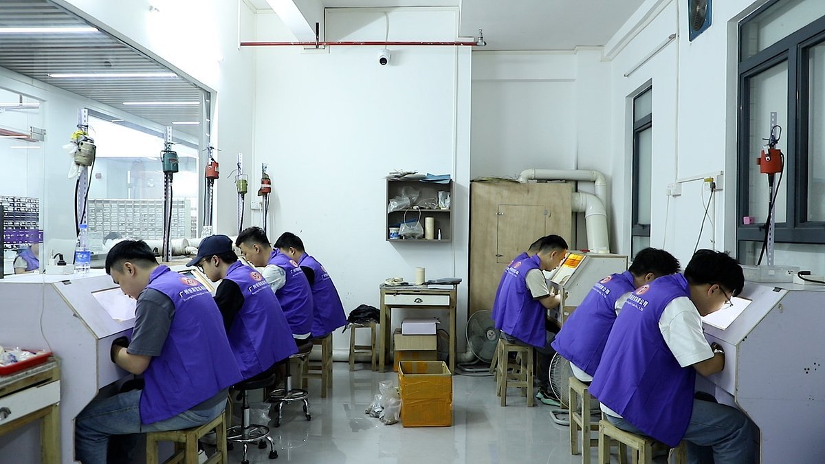 Silversmiths working at custom 925 silver jewelry benches in the Hengdian Silver workshop