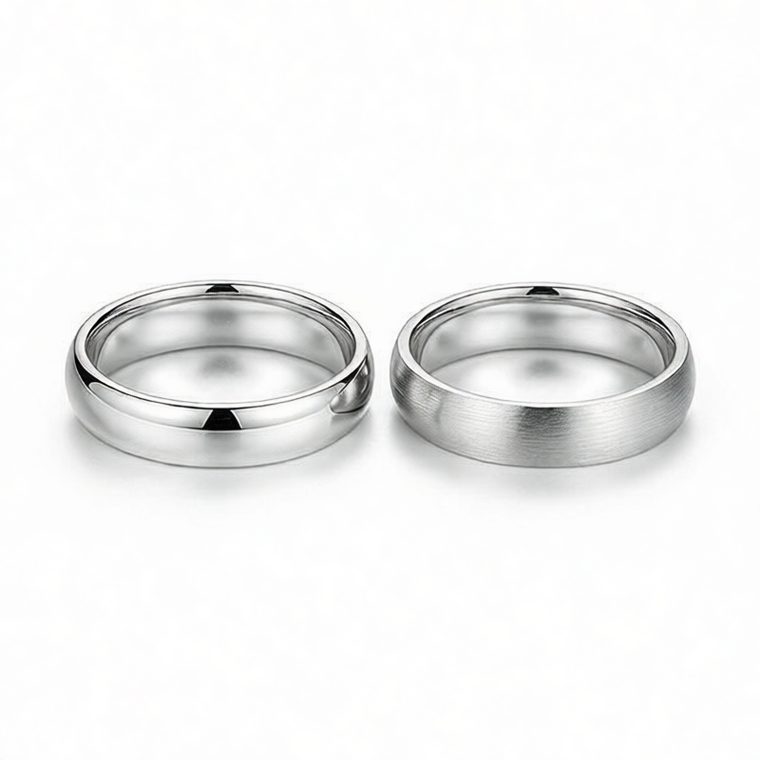 925 sterling silver ring next to a brushed silver ring on white background