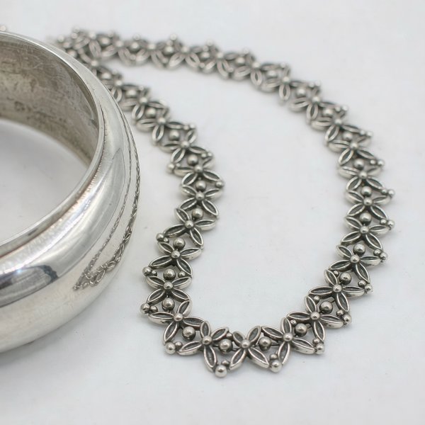 925 sterling silver bangle and chain necklace showing fine metal texture