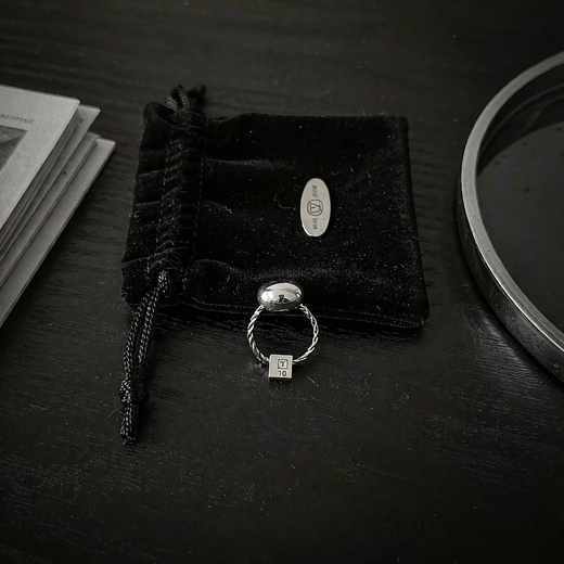 Close-up of silver rings with varied textures for quality assurance reference